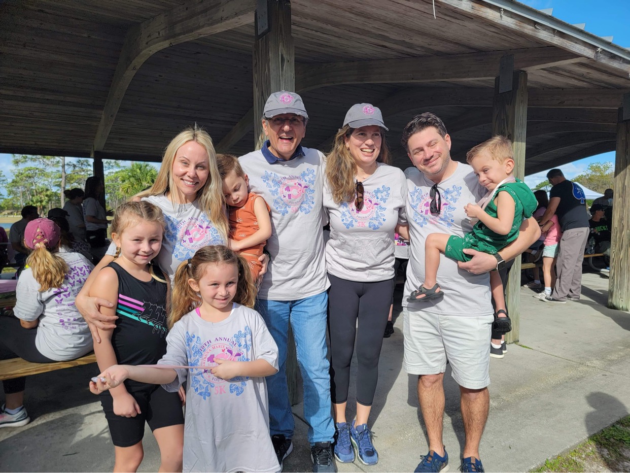 Lisa and her family standing with Dr. Ruben Quintero and fellow participants at a Brianna Marie Foundation event