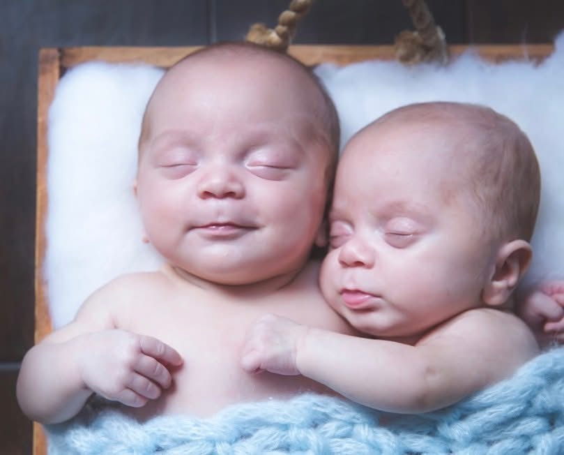 Identical twins Peter and Maurice together showing a size difference